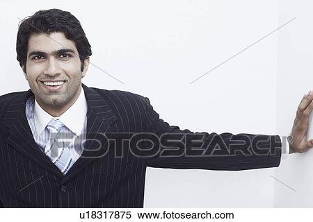 Portrait of a businessman smiling View Large Photo Image Stock Photography - Portrait of a businessman smiling. Fotosearch