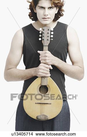 Portrait of a male musician playing the banjo View Large Photo Image Picture - Portrait of a male musician playing the banjo. Fotosearch