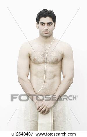 Stock Photo - Portrait of a young man looking serious. Fotosearch