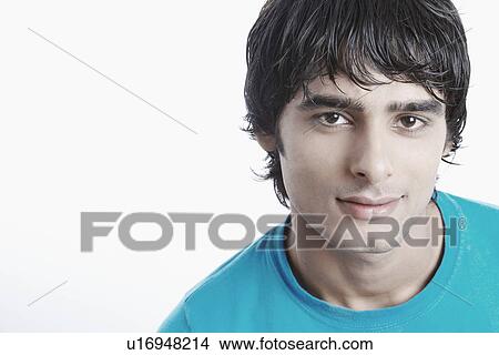 Portrait of a young man smiling View Large Photo Image Picture - Portrait of a young man smiling. Fotosearch