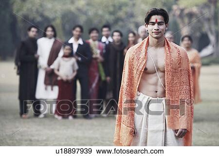 Stock Photo - Portrait of a young man wearing traditional clothing. Fotosearch