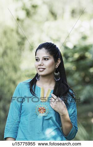 Stock Photography - Close-up of a young woman looking away. Fotosearch