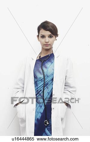 Portrait of a female doctor with a stethoscope around her neck View Large Photo Image Stock Photography - Portrait of a female doctor with a stethoscope around her neck. Fotosearch