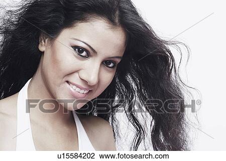 Portrait of a young woman smiling View Large Photo Image Stock Image - Portrait of a young woman smiling. Fotosearch