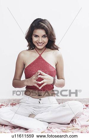 Portrait of a young woman smiling View Large Photo Image Stock Photo - Portrait of a young woman smiling. Fotosearch