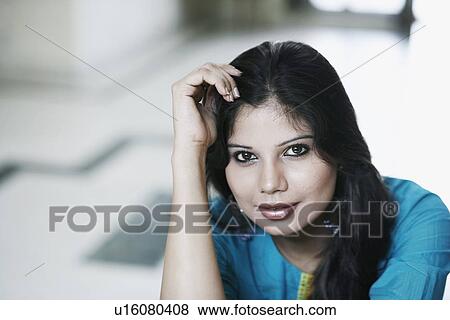 Stock Photo - Portrait of a young woman. Fotosearch