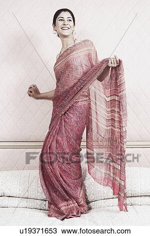 Young woman dancing on the bed View Large Photo Image Stock Image - Young woman dancing on the bed. Fotosearch