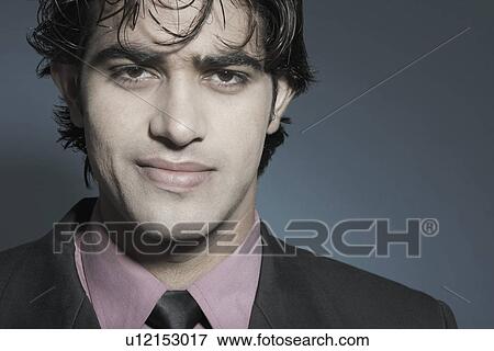 Stock Photo - Portrait of a businessman smiling. Fotosearch