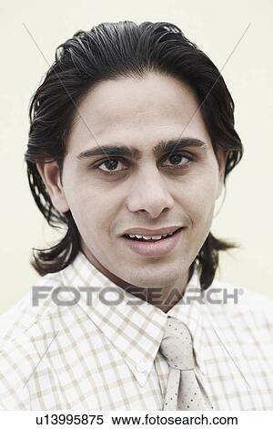 Stock Photography - Portrait of a businessman smiling. Fotosearch