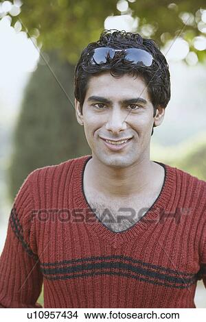 Portrait of a young man smiling View Large Photo Image Picture - Portrait of a young man smiling. Fotosearch