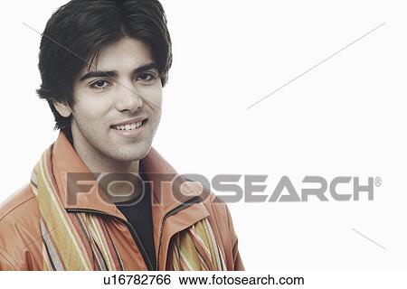 Portrait of a young man smiling View Large Photo Image Stock Photograph - Portrait of a young man smiling. Fotosearch