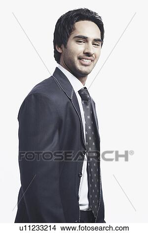 Picture - Side profile of a businessman smiling. Fotosearch