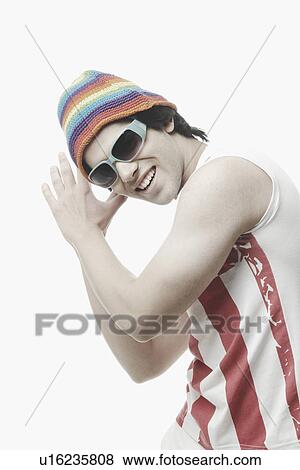 Stock Photo - Side profile of a young man dancing. Fotosearch