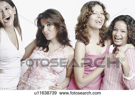 Stock Photo - Close-up of four young women smiling. Fotosearch