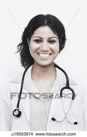 Portrait of a female doctor with a stethoscope around her neck View Large Photo Image Picture - Portrait of a female doctor with a stethoscope around her neck. Fotosearch