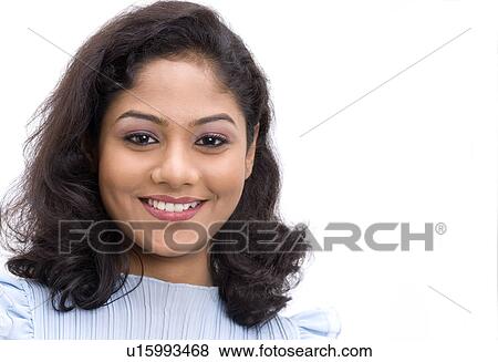 Portrait of a young woman smiling View Large Photo Image Stock Photo - Portrait of a young woman smiling. Fotosearch
