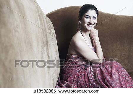 Stock Photography - Portrait of a young woman smiling. Fotosearch