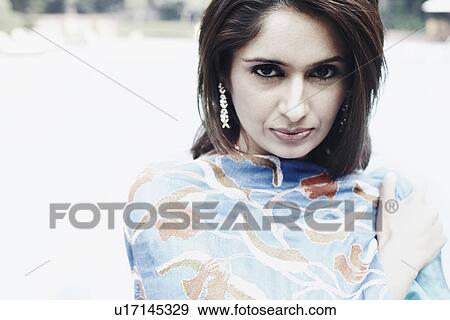 Portrait of a young woman View Large Photo Image Stock Photo - Portrait of a young woman. Fotosearch