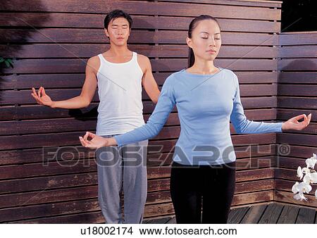 Picture - arms outstretched, beauty spa female, asian ethnicity, adults. Fotosearch