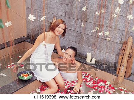 Stock Photo - asian ethnicity, bathrobe, bathing, adults. Fotosearch