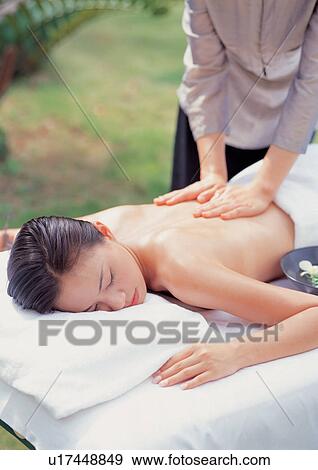 Stock Photo - asian ethnicity, beauty spa female, beautifying, applying. Fotosearch