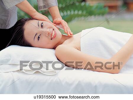 Asian woman enjoying spa treatment View Large Photo Image Stock Image - Asian woman enjoying spa treatment. Fotosearch