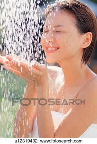 Stock Image - bathrobe, beautification, asian ethnicity. Fotosearch