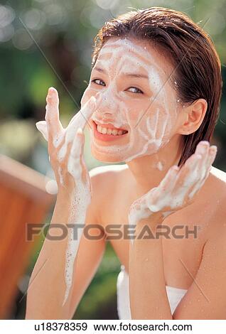 Stock Photo - bathrobe, beautification, asian ethnicity. Fotosearch