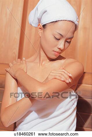 Stock Image - bathrobes, spa, wooden, wood sauna, health spa, beauty spa female. Fotosearch