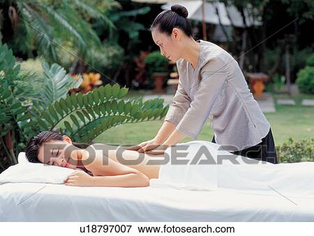 Stock Photo - beautifying, black hair, beauty spa female, applying. Fotosearch