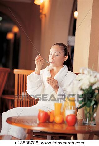 Stock Photography - fruits, table, quarter length, female, asian ethnicity. Fotosearch