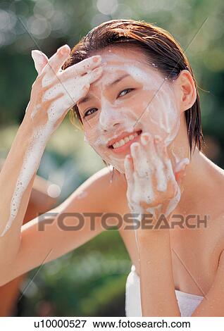 Stock Photo - spa, glancing, happiness, body conscious, wiping, leisure. Fotosearch