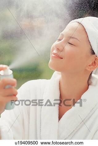 Spa woman spraying her face View Large Photo Image Stock Image - Spa woman spraying her face. Fotosearch