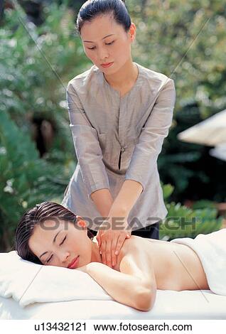 Stock Image - special, body spa, lying down, carefree, closed eyes, beautifying, towel. Fotosearch