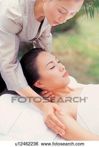 Woman getting a massage View Large Photo Image Stock Photograph - Woman getting a massage. Fotosearch