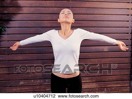 Stock Image - Yoga woman at a spa. Fotosearch