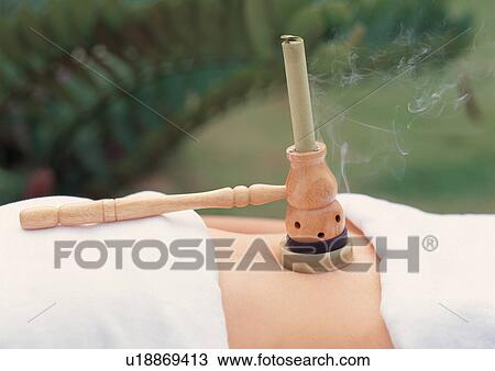 Stock Image - young adult, female, spa, beauty, mid section, body care, massage therapist. Fotosearch