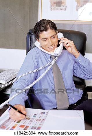 Picture - business, button down shirt, lifestyle, business executive, connectivity. Fotosearch