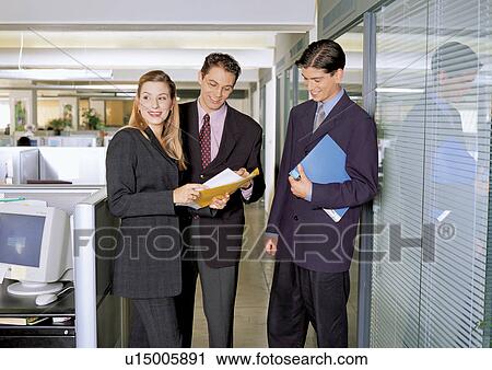 Stock Image - business people, suit, business executive, working, eye glasses, business executives. Fotosearch