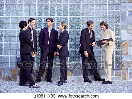 Stock Image - business people, well dressed, business executives, suit. Fotosearch