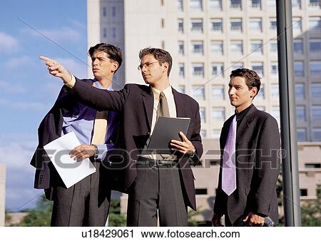 Stock Image - business people, well dressed, business executives, suit. Fotosearch