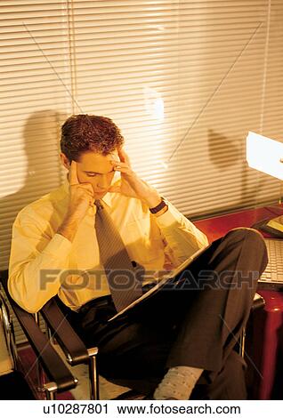 Stock Image - business people, well dressed, indoor, one person. Fotosearch