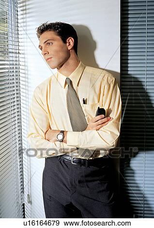 Stock Photo - business people, well dressed, indoor, one person. Fotosearch