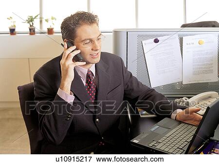 Stock Photo - business people, well dressed, on the phone, connectivity. Fotosearch