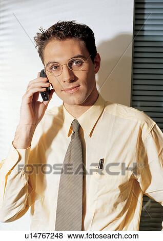 business people, well dressed, on the phone, connectivity View Large Photo Image Stock Photo - business people, well dressed, on the phone, connectivity. Fotosearch