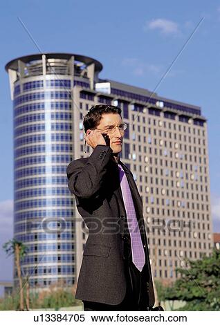 business people, well dressed, on the phone, connectivity View Large Photo Image Stock Photography - business people, well dressed, on the phone, connectivity. Fotosearch
