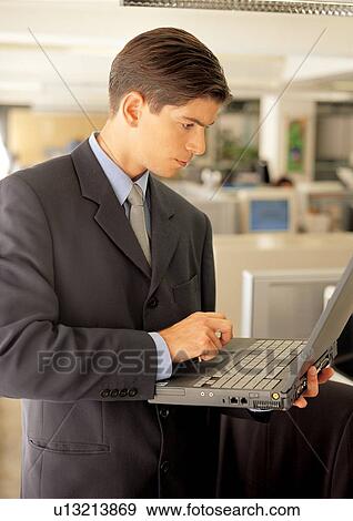 Stock Photo - business people, well dressed, suit, indoor. Fotosearch