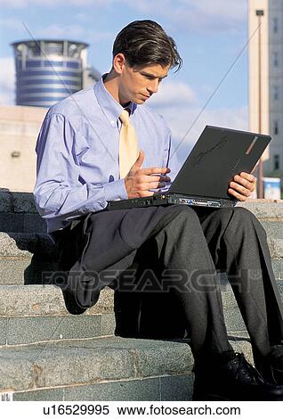 Stock Photography - business people, well dressed, suit, outdoor. Fotosearch