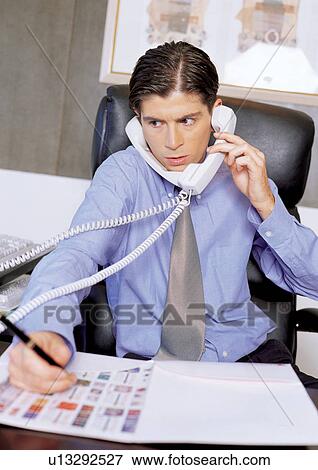 busy, business man, looking away, office table, career, waist up View Large Photo Image Stock Photo - busy, business man, looking away, office table, career, waist up. Fotosearch