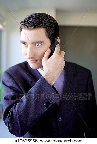 Stock Photograph - close up, well dressed, business people, looking away, head and shoulder. Fotosearch